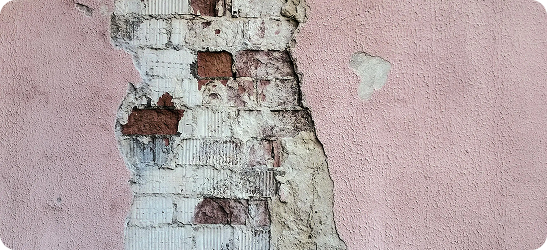 Damaged wall requiring plaster repair