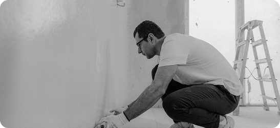 Plasterer skimming a wall